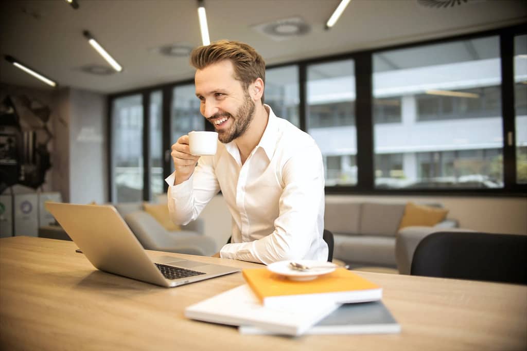 man sitting with a cup