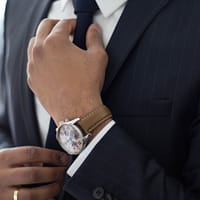 employment attorney man wearing watch with black suit