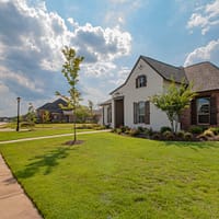 digital marketing tips white and brown house near green grass field under white clouds and blue sky during daytime