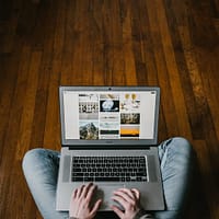 ecommerce business person using laptop on lap