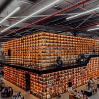 warehouse people in a building with brown cardboard boxes