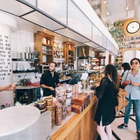 attract more customers woman standing on food counter