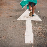 place your business ahead person walking on arrow street sign