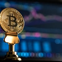 trading bitcoin online selective focus photo of Bitcoin near monitor