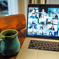 virtual meetings macbook pro displaying group of people