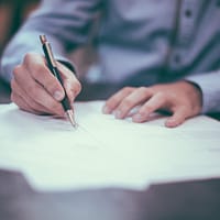 surety bonds man writing on paper