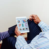 Financial Advisor person sitting on chair holding iPad