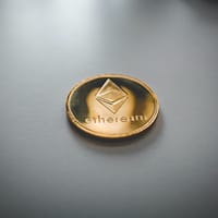 ethereum gold and black round emblem