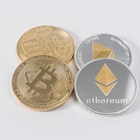 bitcoin ethereum four round silver-colored and gold-colored Bitcoins