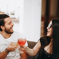 Online Dating Business man in black tank top holding wine glass