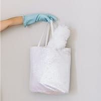 house cleaning business person holding white hand towel