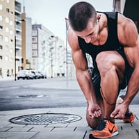 Best Dad Fitness man tying his shoes