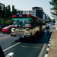 Trucking Authority red and white bus on road during daytime