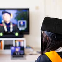 online degree woman in black and yellow shirt sitting on chair