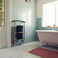 white ceramic bathtub near white bathtub