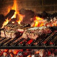 grilled meat on charcoal grill