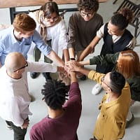 Photo Of People Holding Each Other's Hands