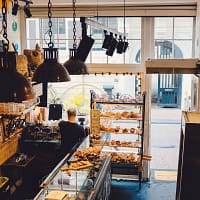 high-angle photography of bread store by day