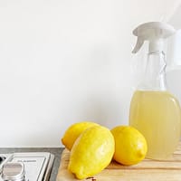 yellow lemon fruit beside clear glass bottle