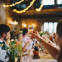 people raising wine glass in selective focus photography