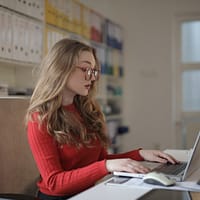 Focused Woman working using Laptop