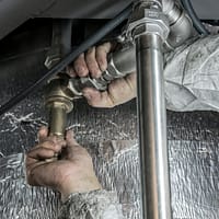 Plumber Installs Pipe Fittings