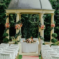 gray and beige gazebo near green leafed tree