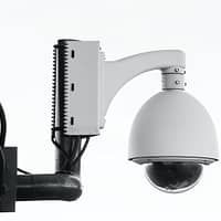 white security camera on post