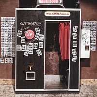 black and white photo booth showing open door