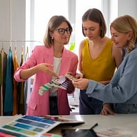 women standing in clothing store