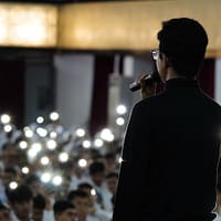 a man standing in front of a crowd of people