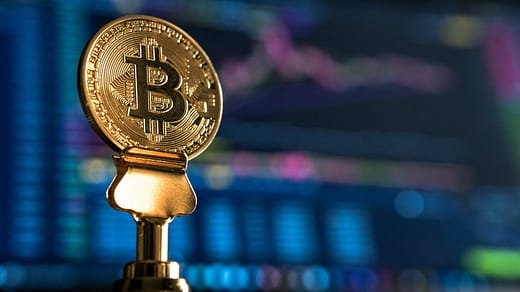 trading bitcoin online selective focus photo of Bitcoin near monitor