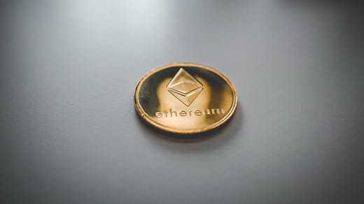 ethereum gold and black round emblem