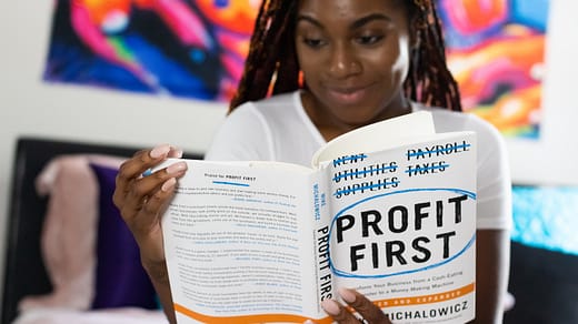 Financial Plan woman in white long sleeve shirt holding white printer paper