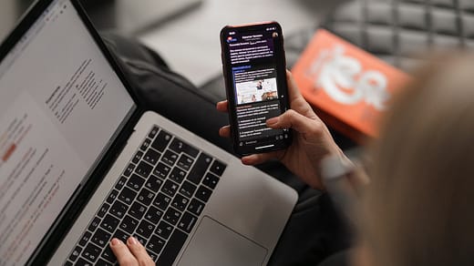 person holding black iphone 4