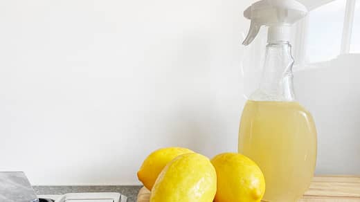 yellow lemon fruit beside clear glass bottle