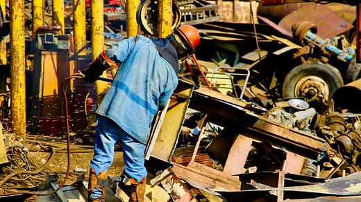 person standing near metal machien