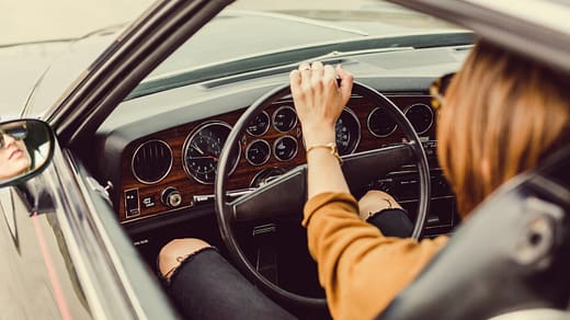 person sitting in the driver seat