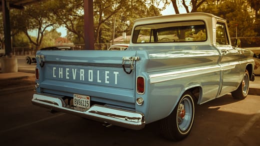 white chevrolet single cab pickup truck parked on road during daytime