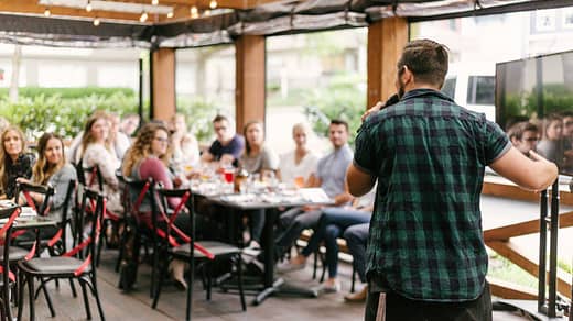 man standing infront of group of people