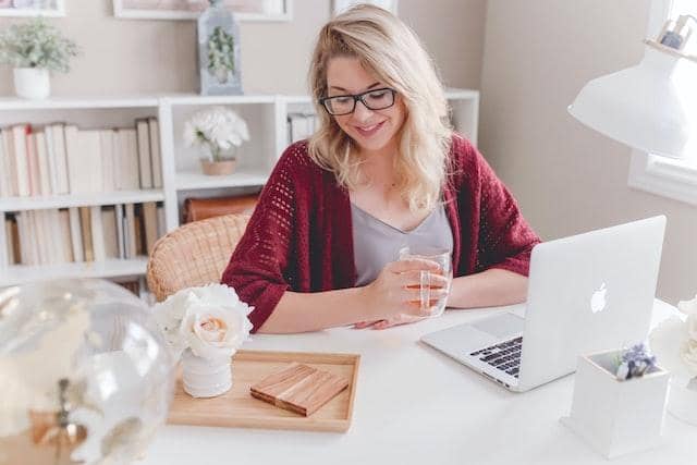 young woman sitting in a home office